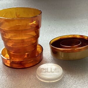 Vintage 1950s pill box with collapsible cup, and decorated Lid